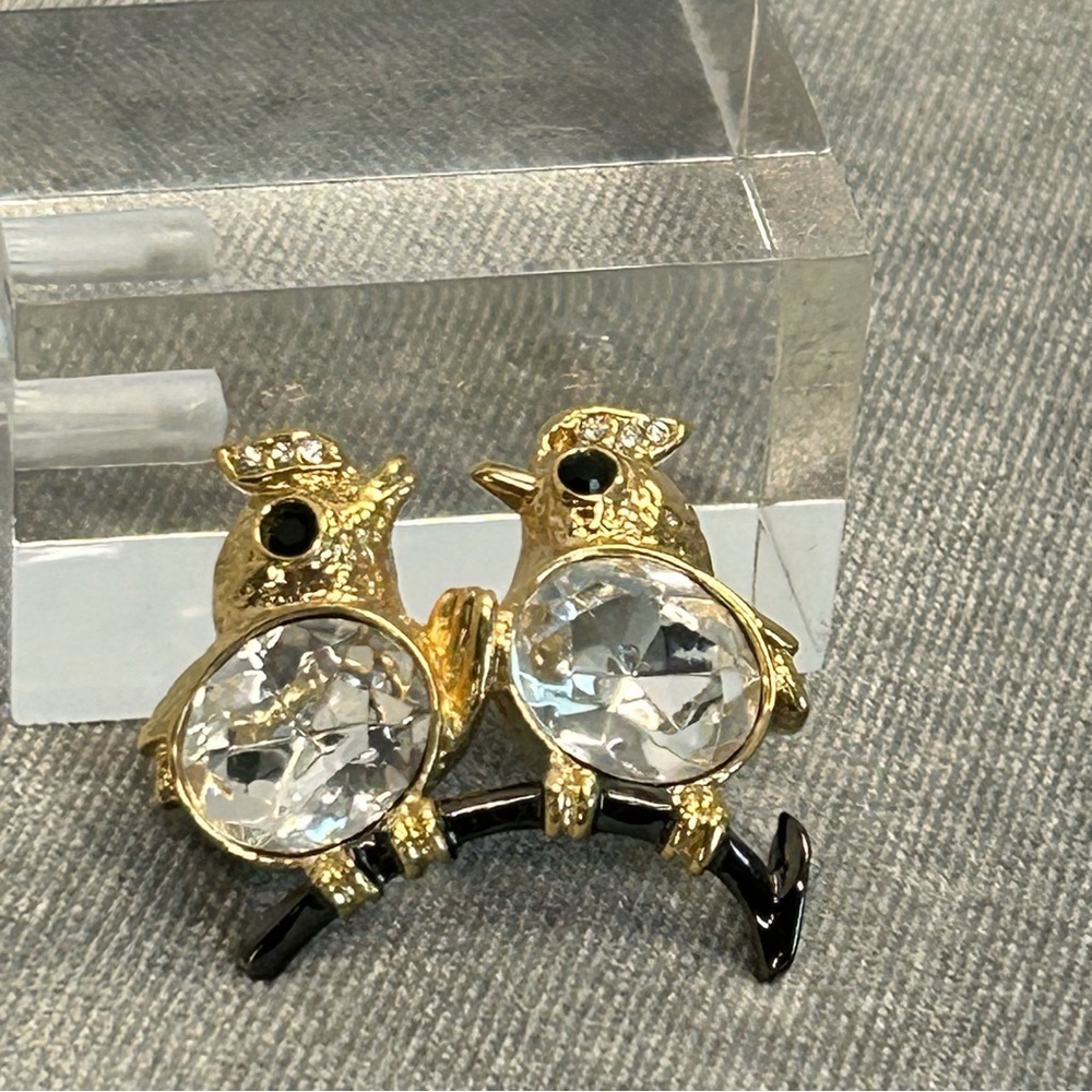 Two crystal rhinestone love birds on a branch brooch pin